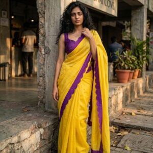 Model wearing a lime green saree with purple border and purple blouse